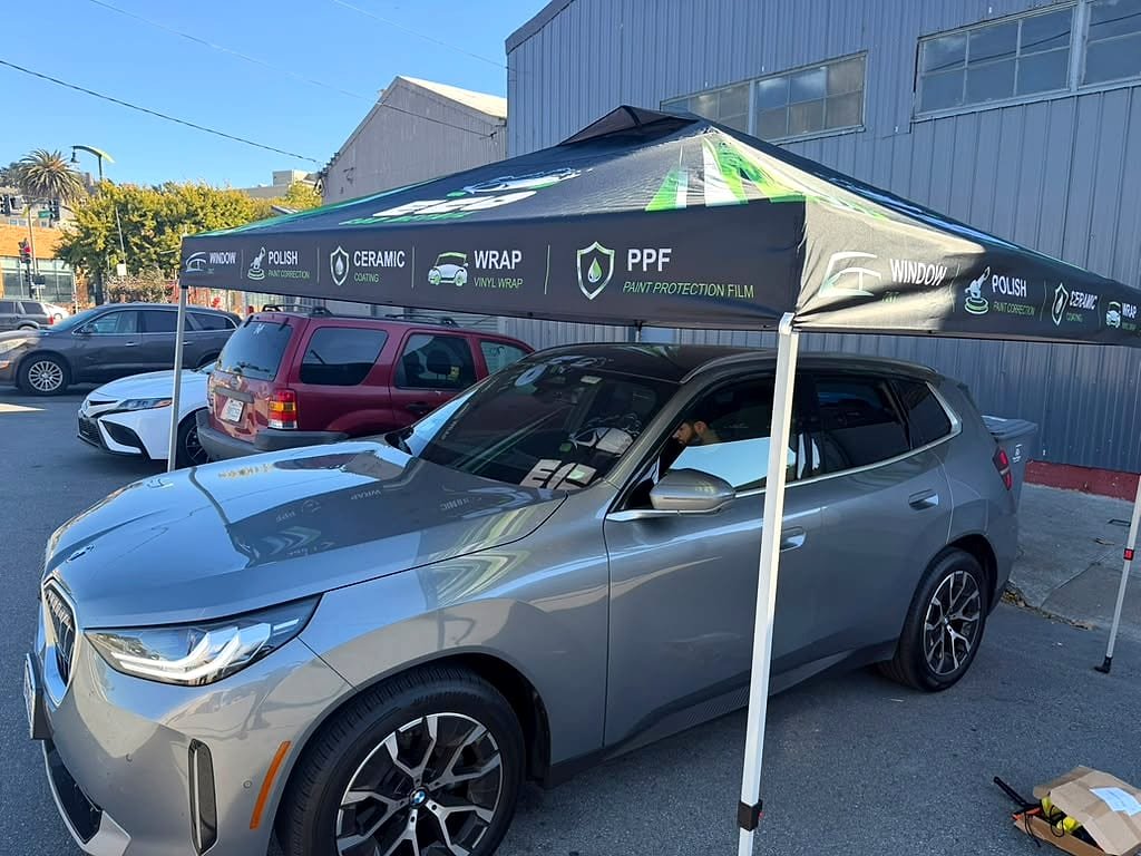 Gray BMW SUV being detailed